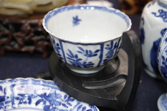 A Chinese blue and white tea bowl and saucer and two jars, Kangxi, some damage, largest diameter 11cm